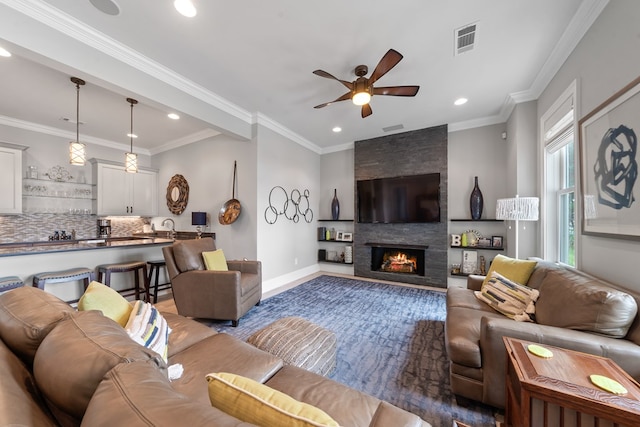 202 Jackson Rd, Milledgeville, GA 31061 - living area with ceiling fan, recessed lighting, a large fireplace, and ornamental molding