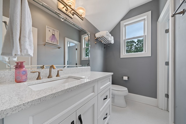 202 Jackson Rd, Milledgeville, GA 31061 - bathroom featuring vanity, lofted ceiling, and plenty of natural light