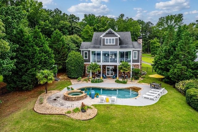 202 Jackson Rd, Milledgeville, GA 31061 - rear view of house featuring stone siding, a patio area, a chimney, a pool with connected hot tub, and a balcony