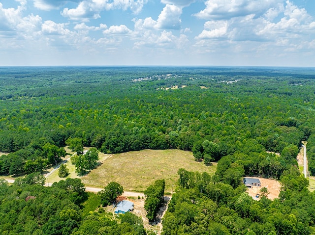 drone / aerial view featuring a view of trees