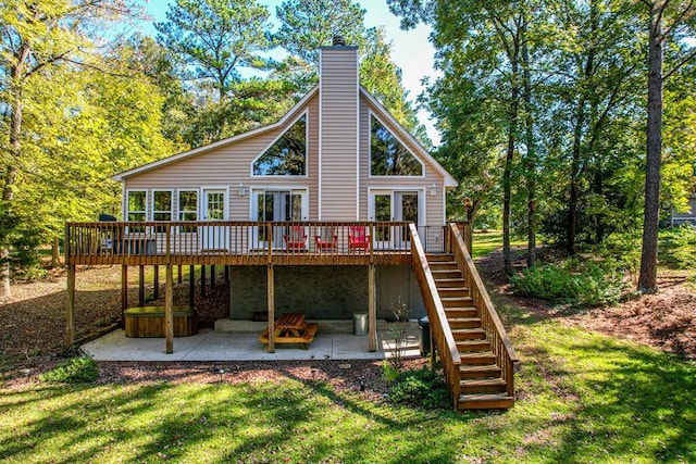 back of house featuring a patio area, a yard, and a wooden deck