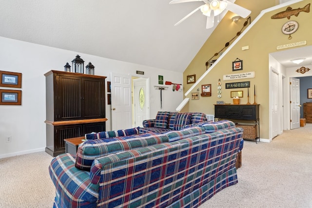 carpeted living room with ceiling fan and lofted ceiling