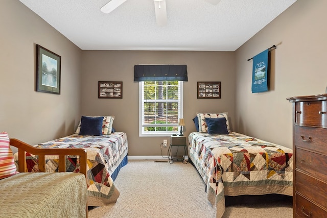 carpeted bedroom with a textured ceiling and ceiling fan