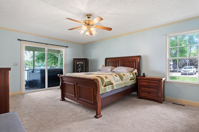 bedroom with access to exterior, light colored carpet, crown molding, baseboards, and ceiling fan