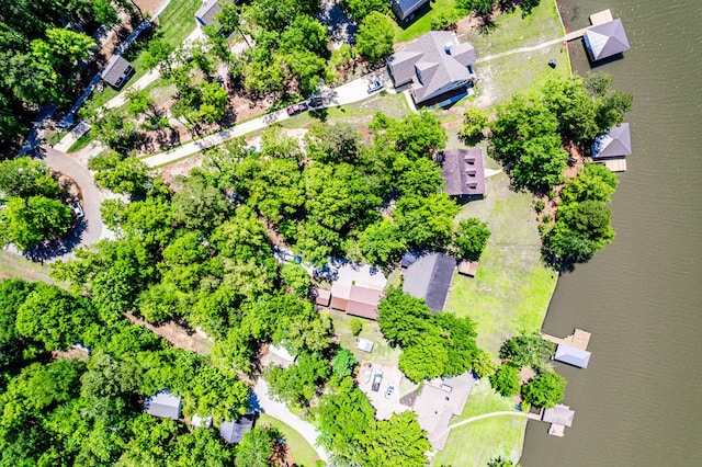 aerial view of residential area featuring a nearby body of water