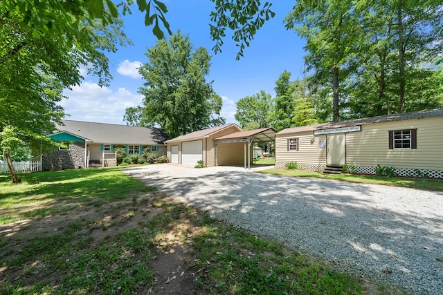 view of front of property featuring entry steps, an outdoor structure, and a garage