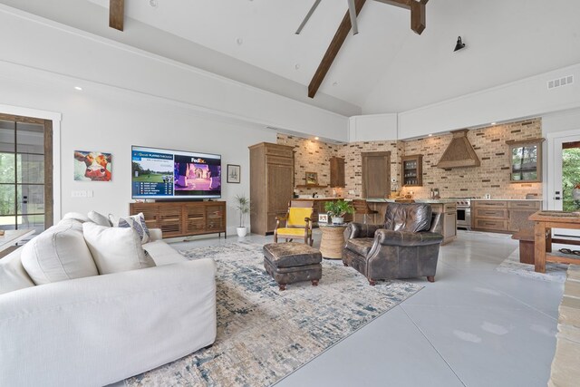 2163 N Jefferson St, Milledgeville, GA 31061 - living room featuring high vaulted ceiling, finished concrete flooring, and beam ceiling