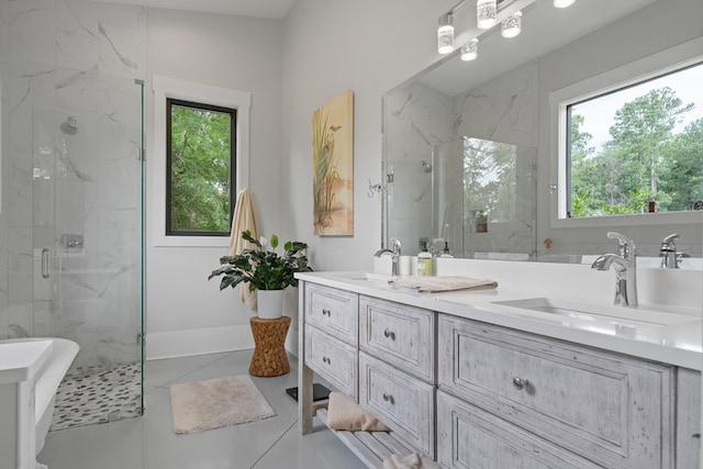 2163 N Jefferson St, Milledgeville, GA 31061 - full bath featuring healthy amount of natural light, a marble finish shower, double vanity, and tile patterned flooring