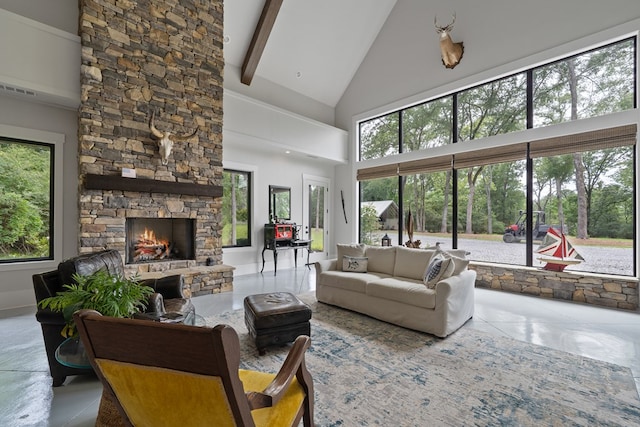 2163 N Jefferson St, Milledgeville, GA 31061 - tiled living area with high vaulted ceiling, a stone fireplace, and beamed ceiling