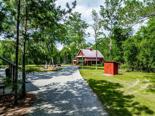 2163 N Jefferson St, Milledgeville, GA 31061 - surrounding community with a storage shed, a yard, and driveway