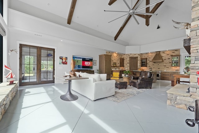 2163 N Jefferson St, Milledgeville, GA 31061 - living room with high vaulted ceiling, french doors, light tile patterned floors, and beamed ceiling