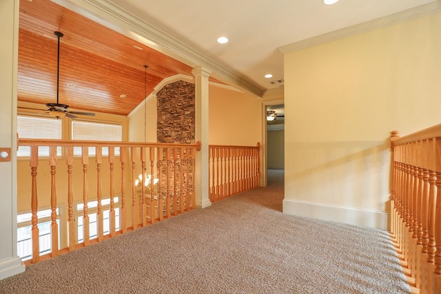 hallway with baseboards, recessed lighting, vaulted ceiling, crown molding, and carpet flooring