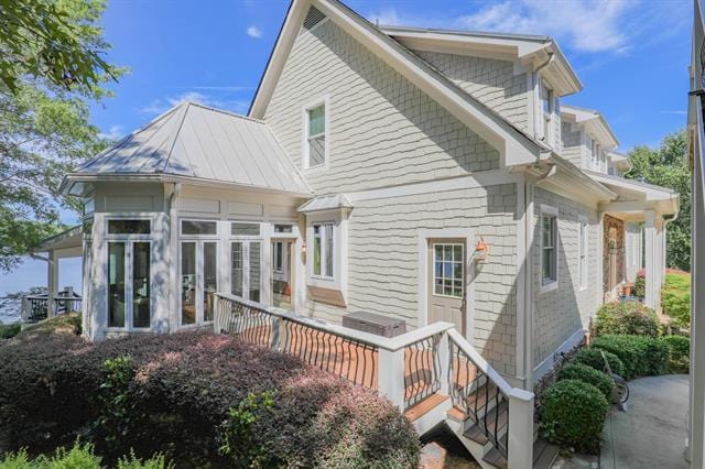 rear view of house with a sunroom