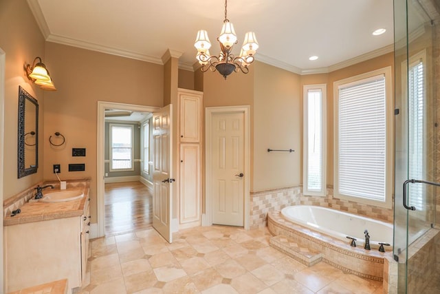 full bathroom with a shower stall, a chandelier, a garden tub, ornamental molding, and vanity