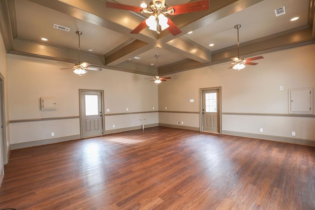 unfurnished room featuring baseboards, ornamental molding, beam ceiling, wood finished floors, and a ceiling fan
