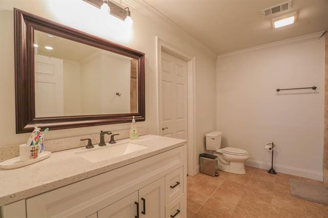 bathroom featuring visible vents, toilet, ornamental molding, baseboards, and vanity