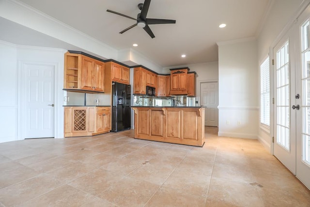 kitchen featuring open shelves, black appliances, ceiling fan, and a healthy amount of sunlight