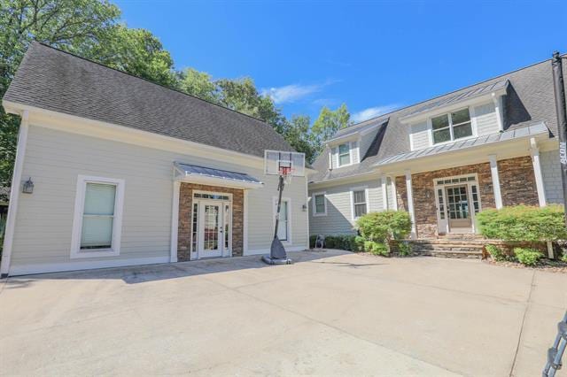 view of front of house with french doors and stone siding