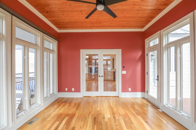unfurnished sunroom with french doors, visible vents, and crown molding