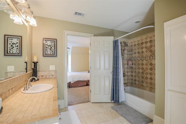 bathroom with vanity, tile patterned floors, shower / bathtub combination with curtain, and visible vents