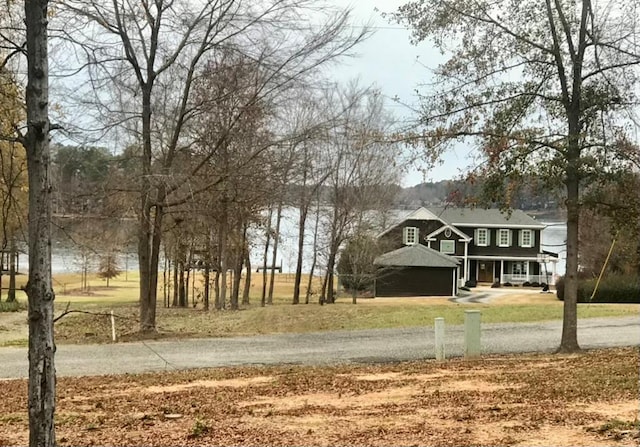 view of yard with covered porch