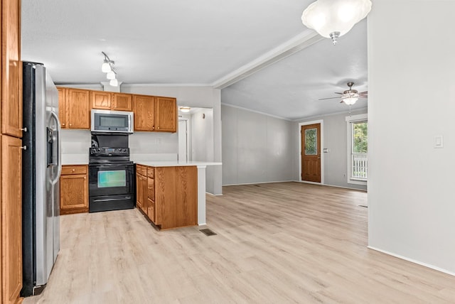 kitchen featuring kitchen peninsula, crown molding, light hardwood / wood-style floors, lofted ceiling, and appliances with stainless steel finishes