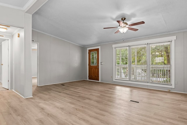 unfurnished living room featuring crown molding, ceiling fan, and light wood-type flooring