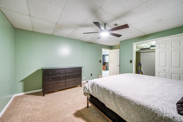 154 Old Plantation Trl, Milledgeville, GA 31061 - bedroom featuring a drop ceiling, baseboards, carpet flooring, ceiling fan, and a closet