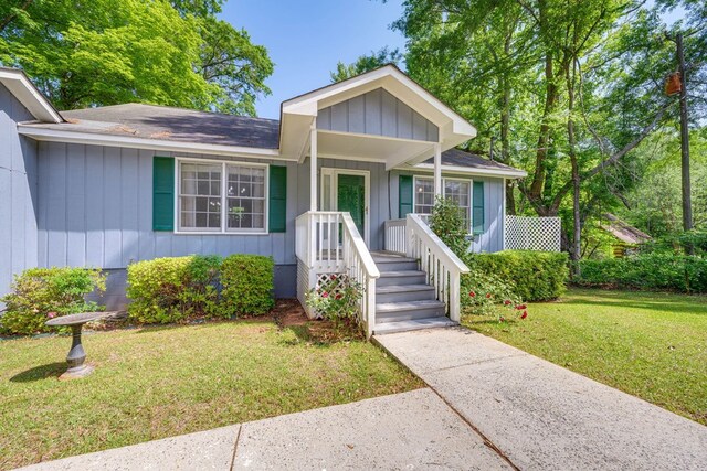 154 Old Plantation Trl, Milledgeville, GA 31061 - view of front of property with a front lawn and a shingled roof