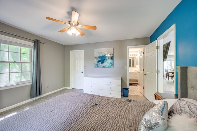 154 Old Plantation Trl, Milledgeville, GA 31061 - bedroom with carpet flooring, baseboards, a ceiling fan, and ensuite bath