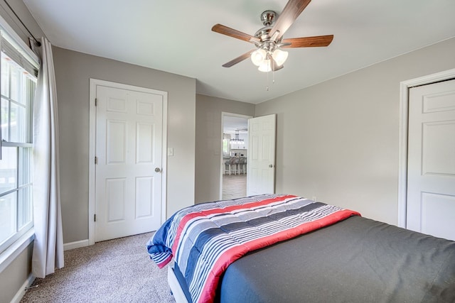 154 Old Plantation Trl, Milledgeville, GA 31061 - carpeted bedroom with multiple windows, baseboards, and ceiling fan