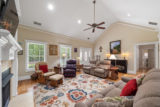 411 Rockville Rd, Eatonton, GA 31024 - living area featuring a tile fireplace, ceiling fan, crown molding, light wood-type flooring, and recessed lighting