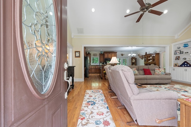 411 Rockville Rd, Eatonton, GA 31024 - living room featuring ceiling fan, ornamental molding, light wood-type flooring, lofted ceiling, and built in features