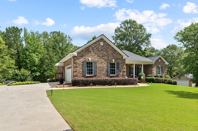 411 Rockville Rd, Eatonton, GA 31024 - view of front of house featuring an attached garage, driveway, brick siding, and a front lawn