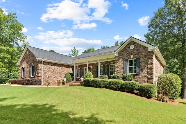 411 Rockville Rd, Eatonton, GA 31024 - ranch-style house with a front lawn, brick siding, and a porch