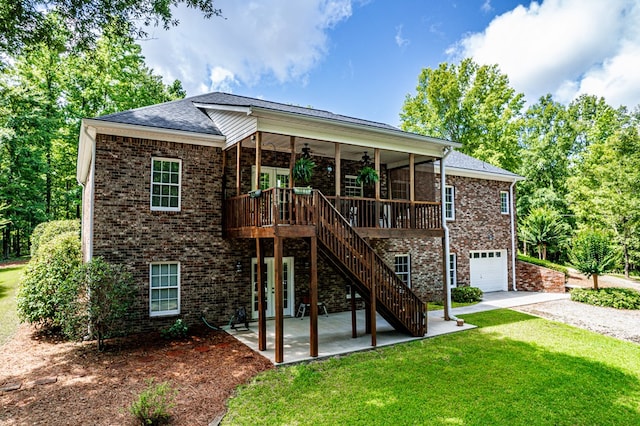 411 Rockville Rd, Eatonton, GA 31024 - view of front of home with ceiling fan, a front lawn, brick siding, a patio, and driveway
