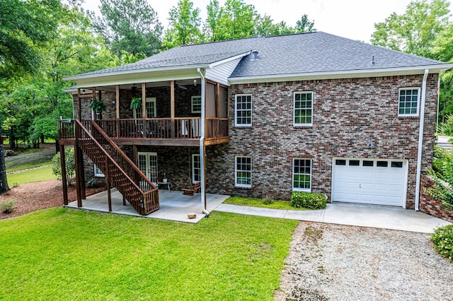 411 Rockville Rd, Eatonton, GA 31024 - back of house featuring driveway, a patio area, a lawn, a sunroom, and a ceiling fan