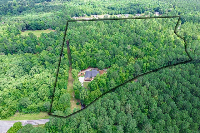 411 Rockville Rd, Eatonton, GA 31024 - aerial overview of property's location with a heavily wooded area and property boundaries highlighted