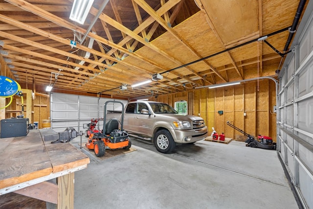 411 Rockville Rd, Eatonton, GA 31024 - garage featuring a garage door opener