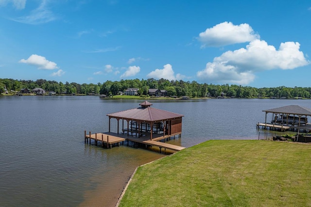 view of dock featuring a gazebo, a yard, and a water view