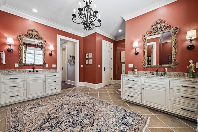 bathroom featuring tile patterned flooring, vanity, crown molding, and an inviting chandelier