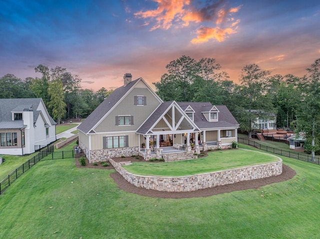 view of front of home featuring a lawn