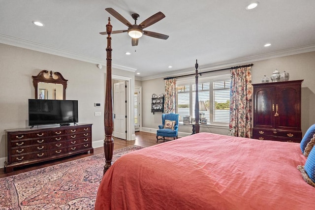 bedroom featuring hardwood / wood-style floors, ceiling fan, and ornamental molding