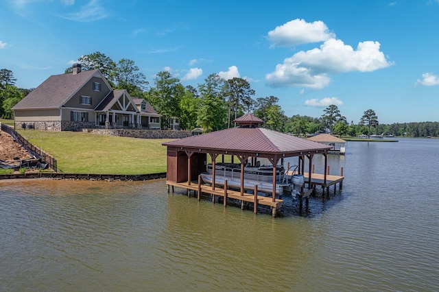 view of dock featuring a lawn and a water view