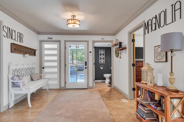 interior space with light tile patterned flooring and crown molding