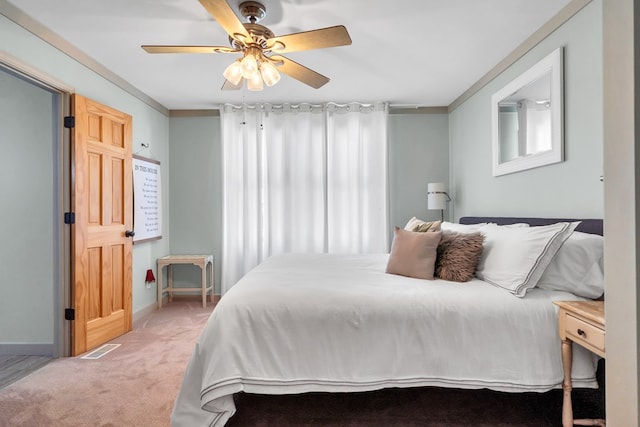 bedroom with ceiling fan and carpet floors