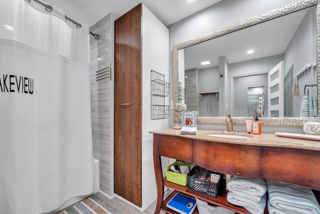 bathroom featuring vanity, shower / bath combo, and hardwood / wood-style flooring