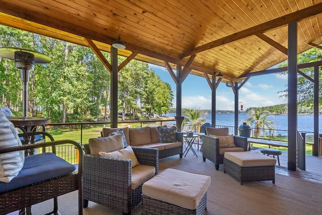 view of patio with an outdoor living space and a water view