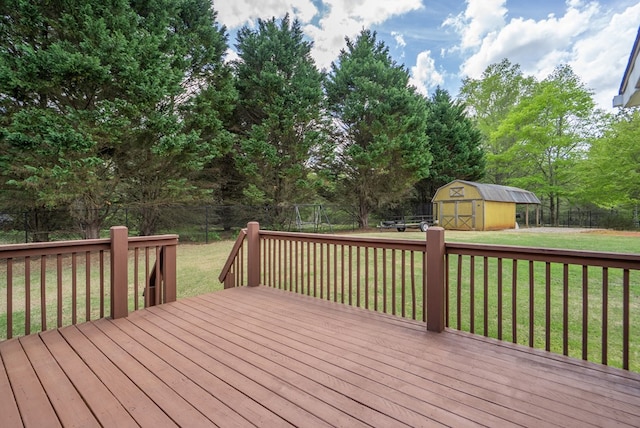 220 Pitts Chapel Rd, Newborn, GA 30056 - wooden deck with a fenced backyard, an outdoor structure, a storage shed, and a yard