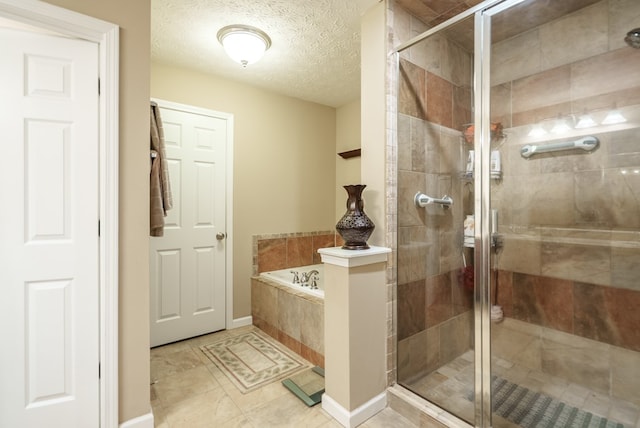 220 Pitts Chapel Rd, Newborn, GA 30056 - full bath featuring a bath, a textured ceiling, tile patterned flooring, and a stall shower